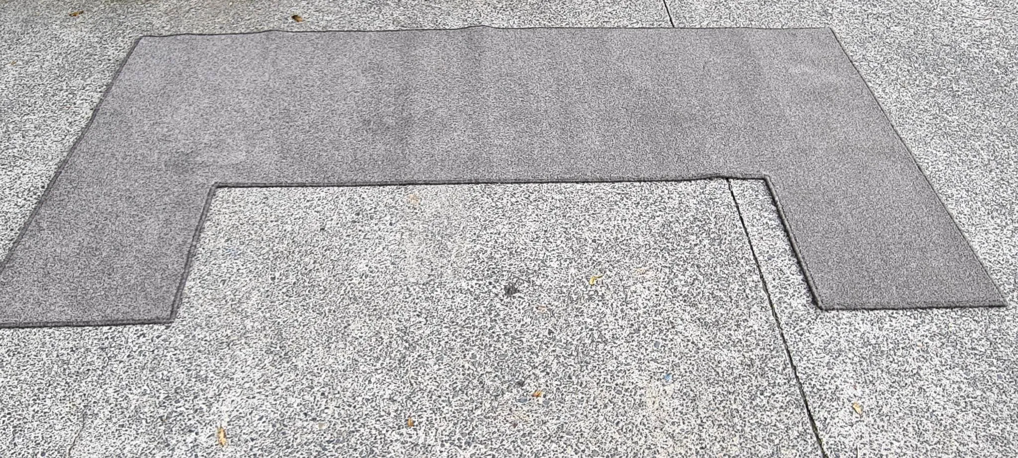 Custom grey U-shaped carpet with professional overlocked serged edges