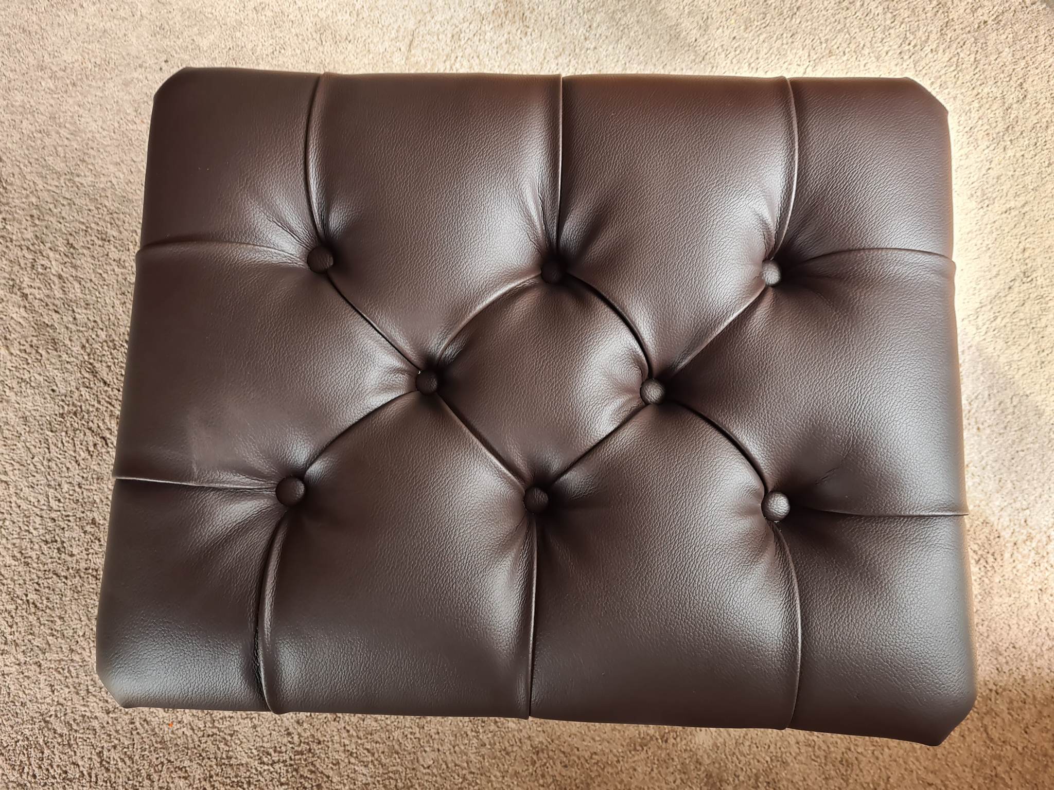 Dining chair being reupholstered on the workbench